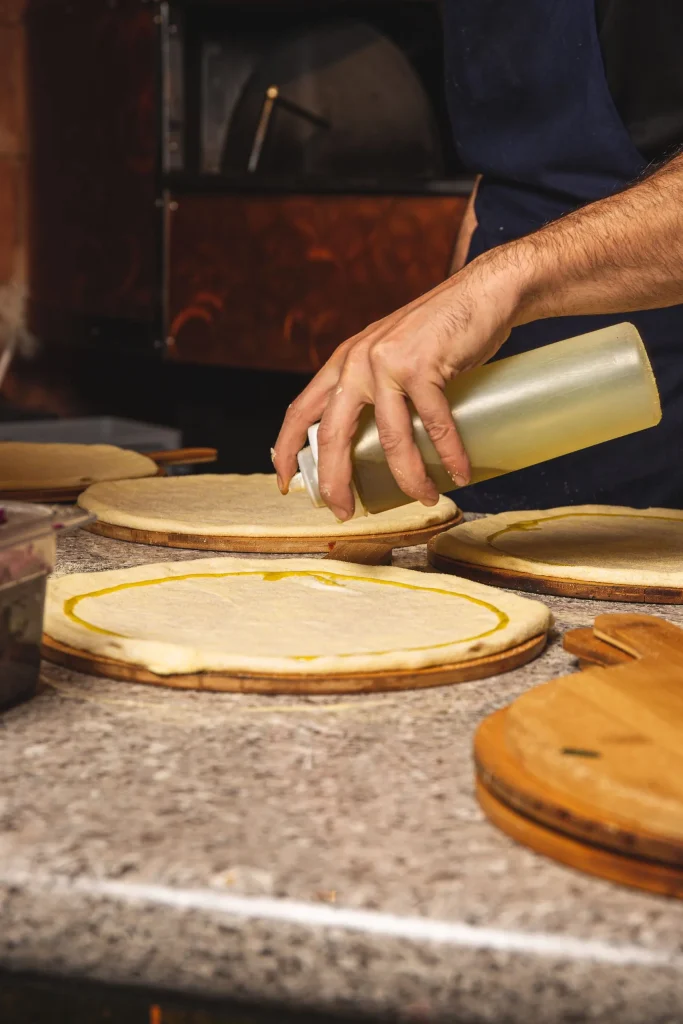 Gallio Mediterranean Restaurant London Chef Making Pizza Experts in Dough scaled